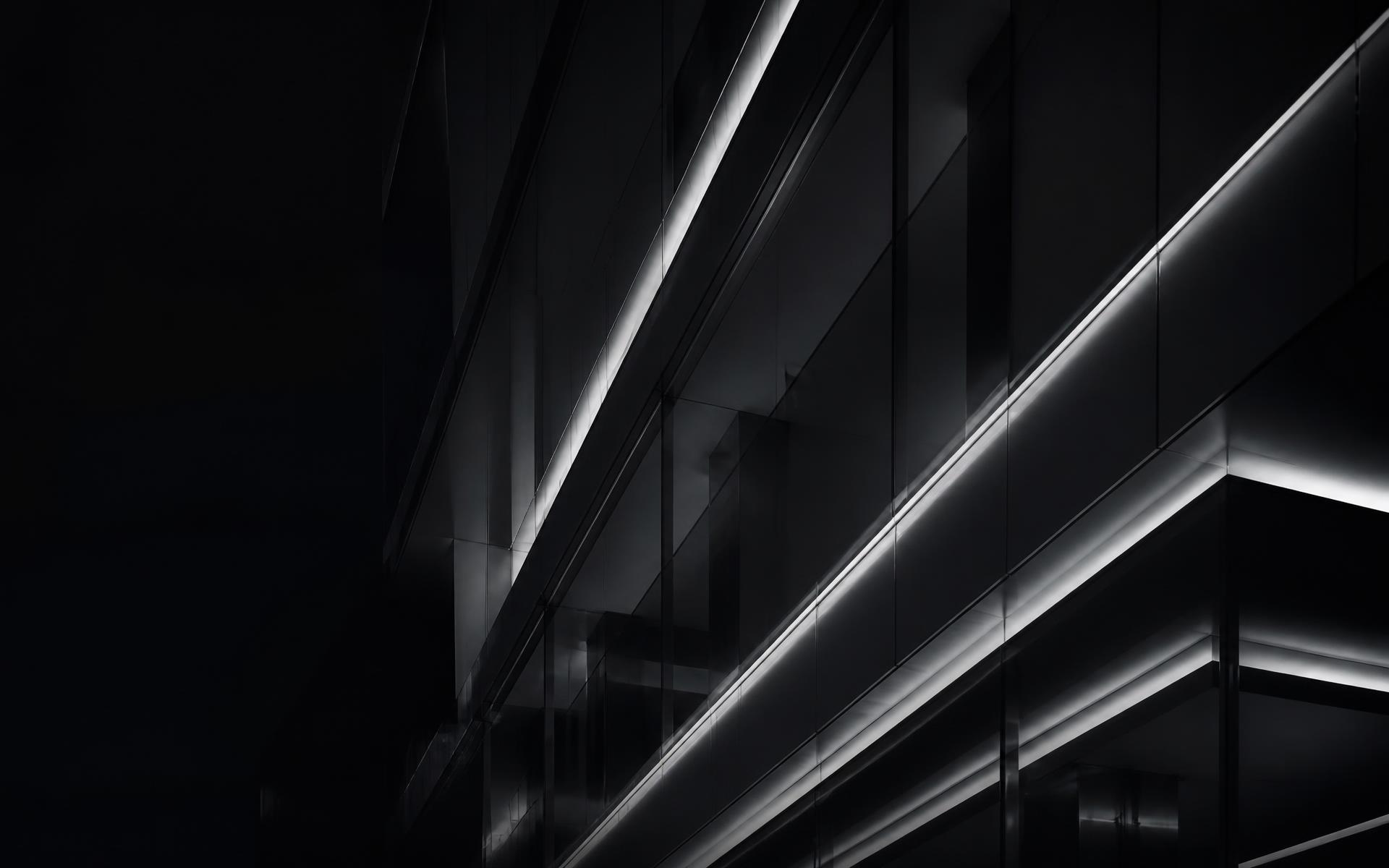 Dark architectural glass and steel facade at night